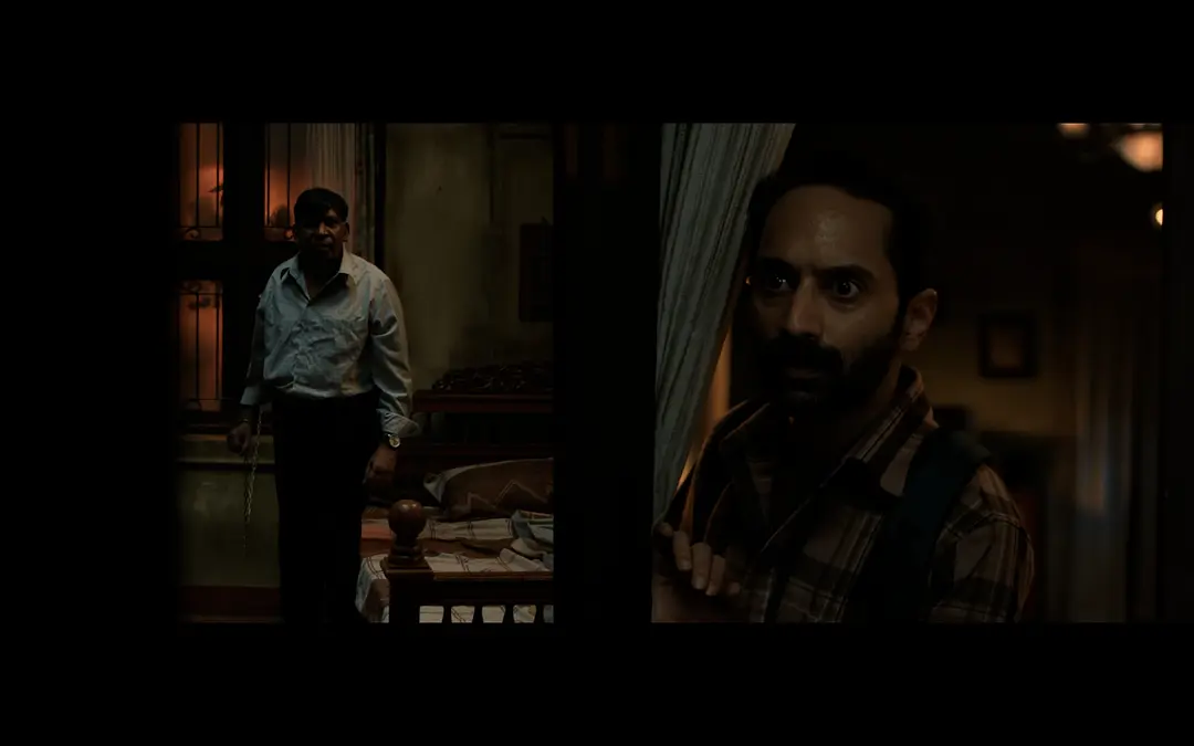 维拉在农场昏暗的灯光下与迦纳许对峙