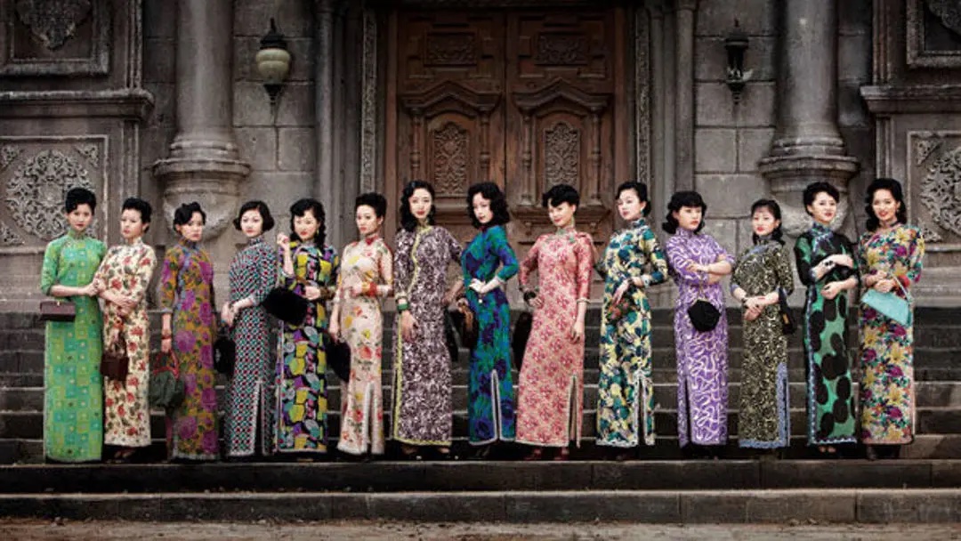 13 women on steps